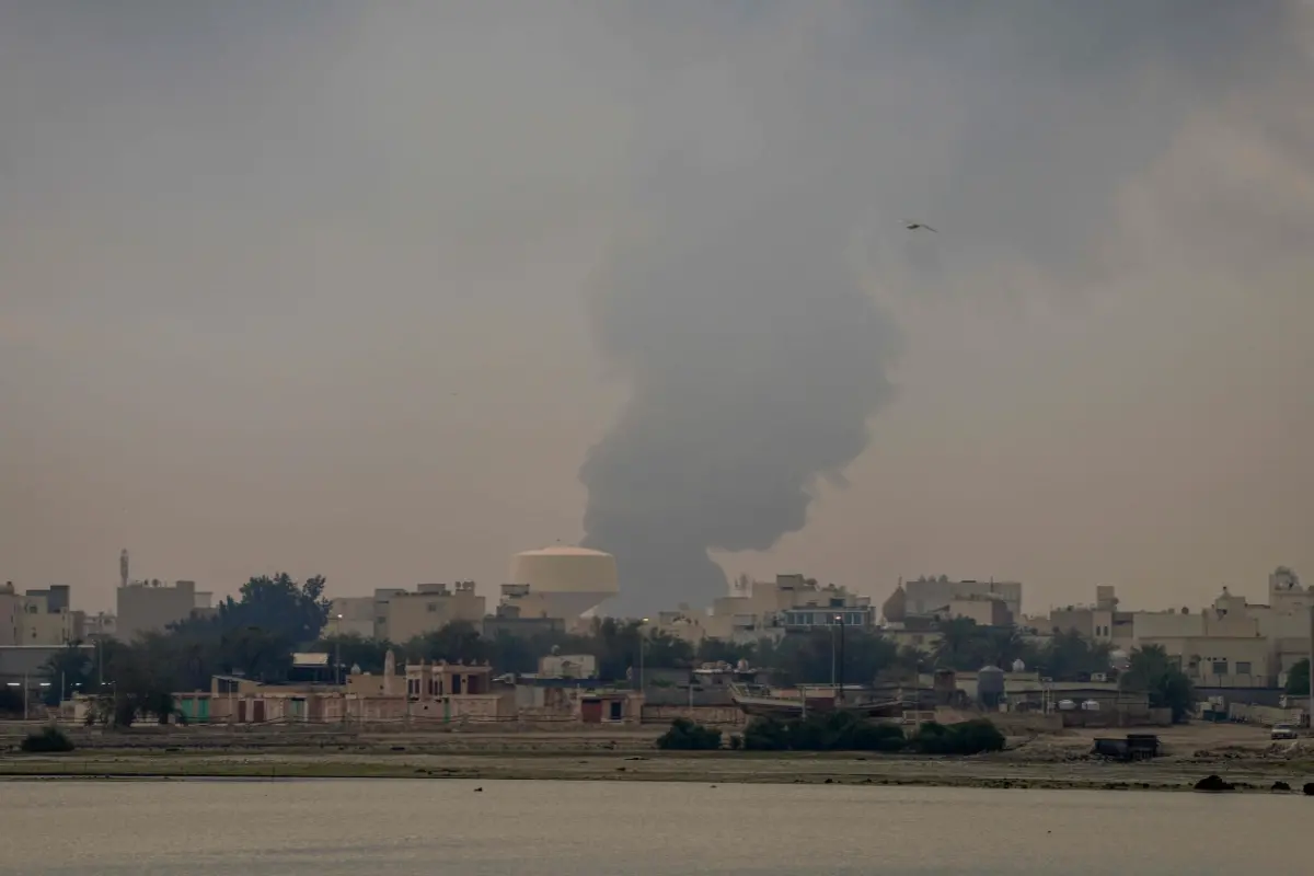 A plume of smoke rises after a reported Iranian strike in Oman.| Photo: AFP