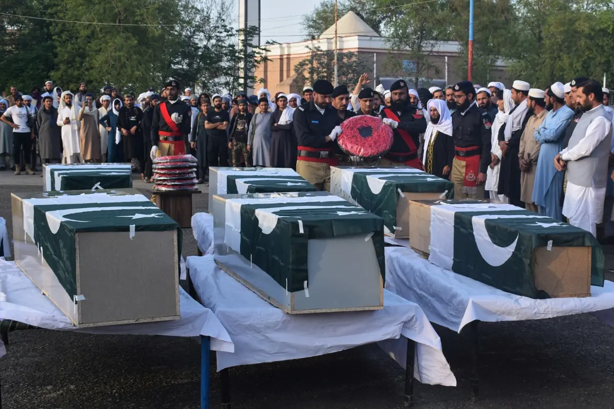 People attend the funeral prayers of police officers, killed in the roadside bomb explosion, outskirts of Lakki Marwat, a district in northwest Pakistan | Photo: AP
