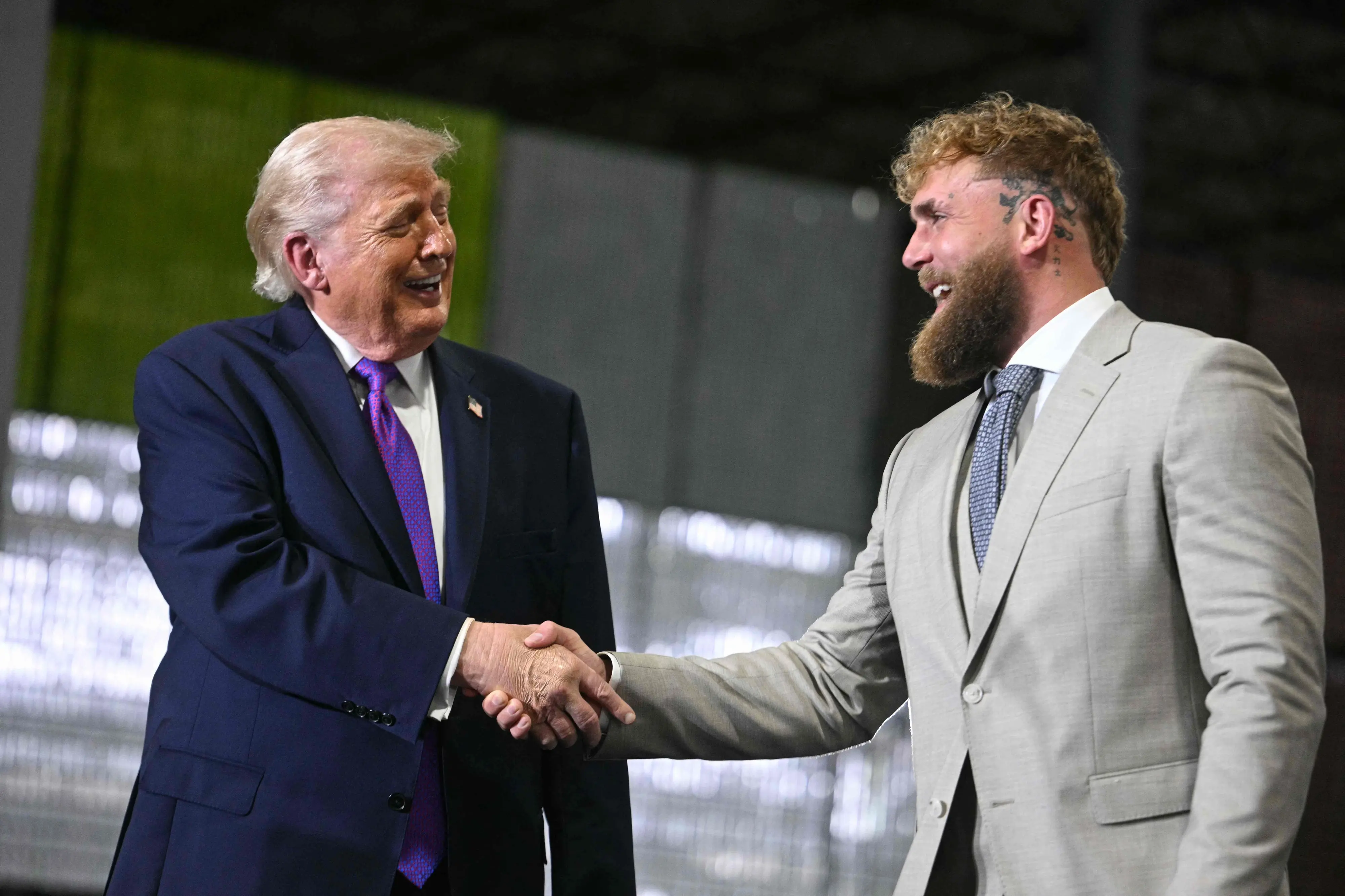 US President Donald Trump shakes hands with US boxer and influencer Jake Paul | Photo: AFP