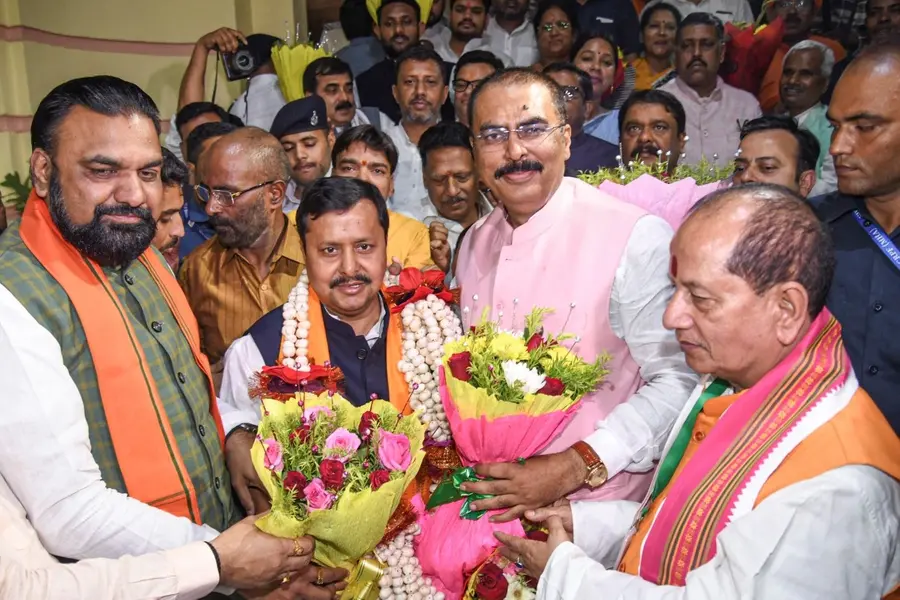 Bihar Deputy Chief Ministers Samrat Chaudhary, left, Vijay Kumar Sinha, right, and others greet BJP President Nitin Nabin after the NDA swept all five Bihar seats in the Rajya Sabha elections, in Patna
