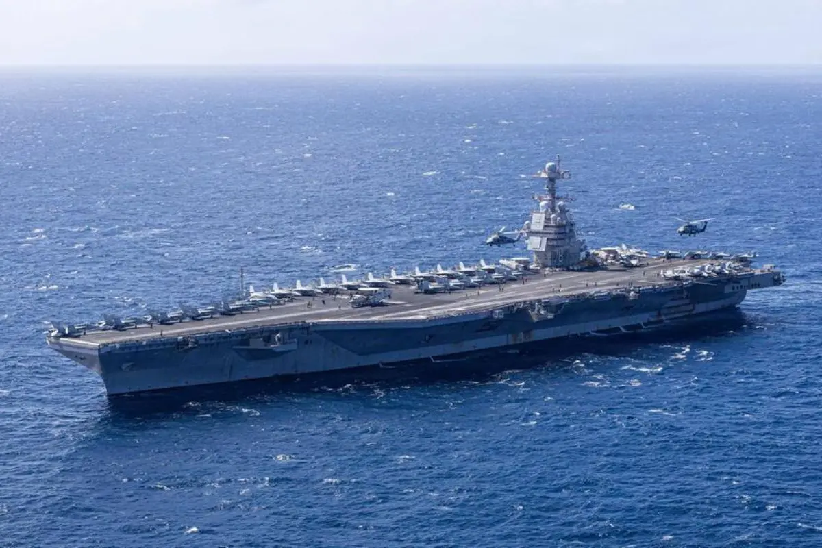 USS Gerald R. Ford (CVN-78), the US Navy's largest aircraft carrier, sails during deployment as crew members continue operations after a 30-hour onboard fire displaced hundreds of sailors.