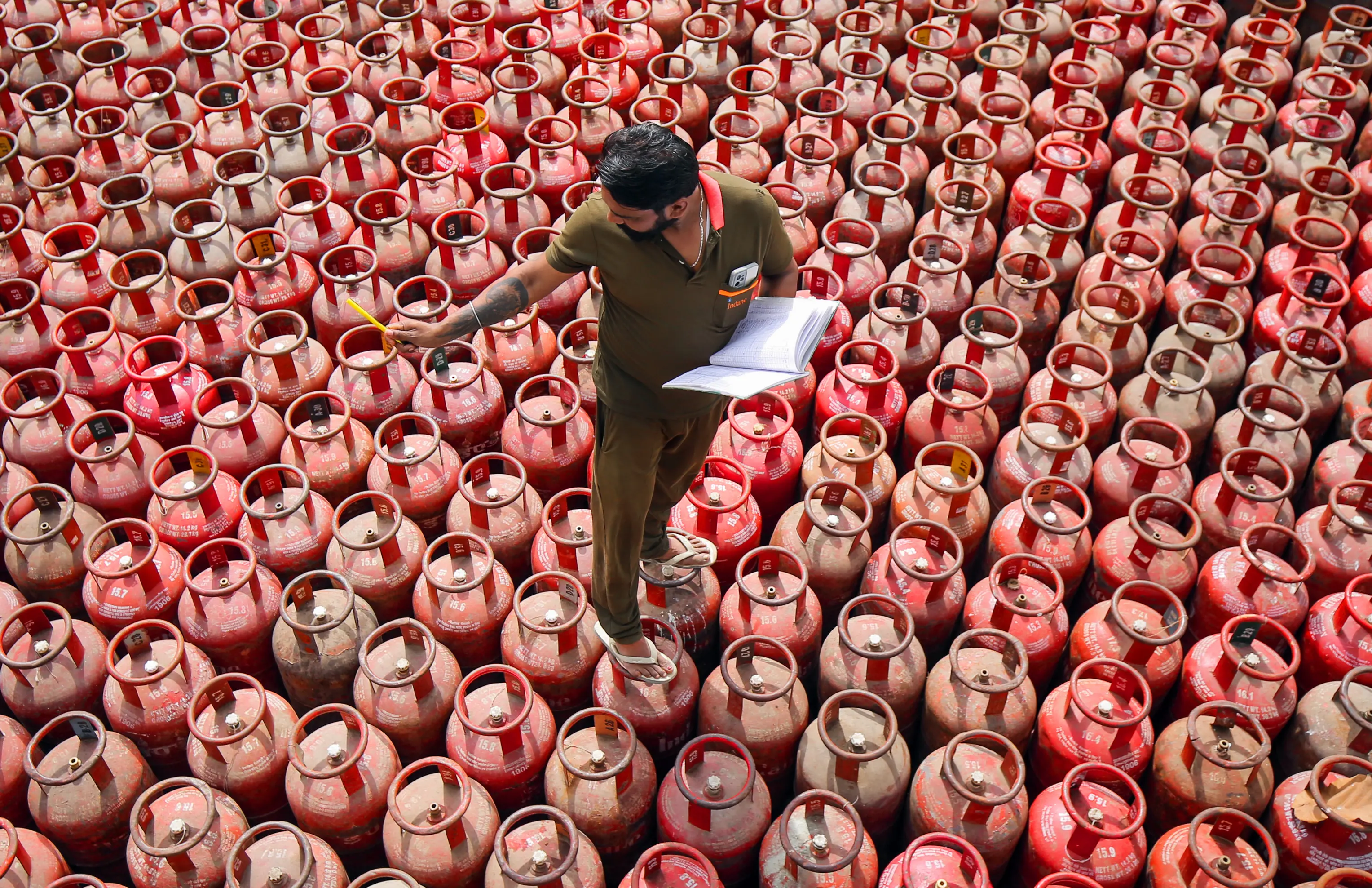 A worker sorts out domestic gas cylinders at an Indian Oil godown on the outskirts of Amritsar | Photo: ANI