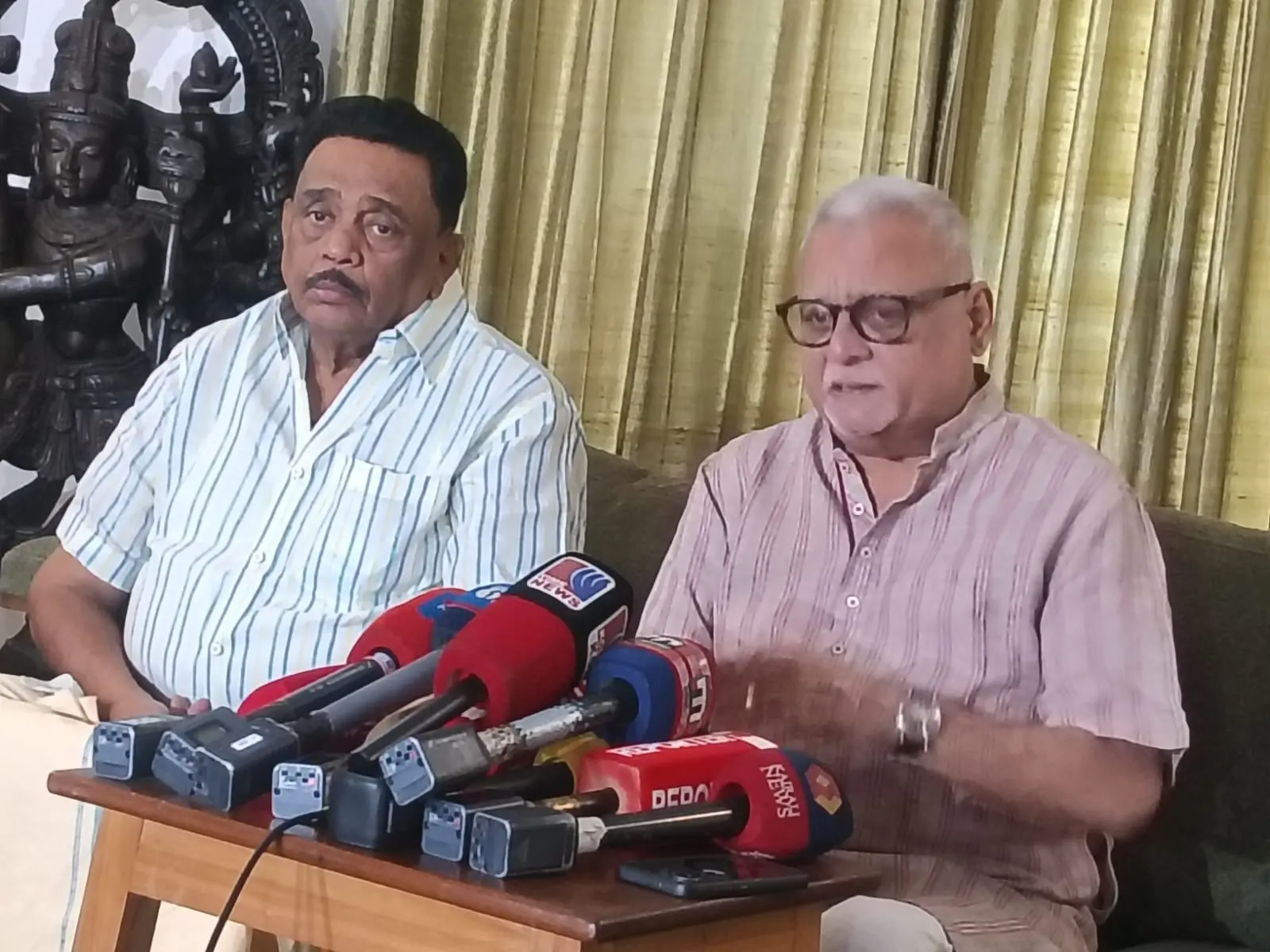 RJD state president M.V. Shreyams Kumar (right) announces the candidates.