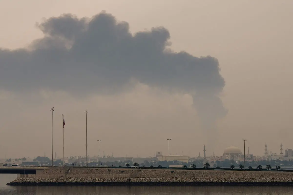 A plume of smoke rises after a reported Iranian strike on fuel tanks in Muharraq on March 12, 2026 (Photo: AFP)