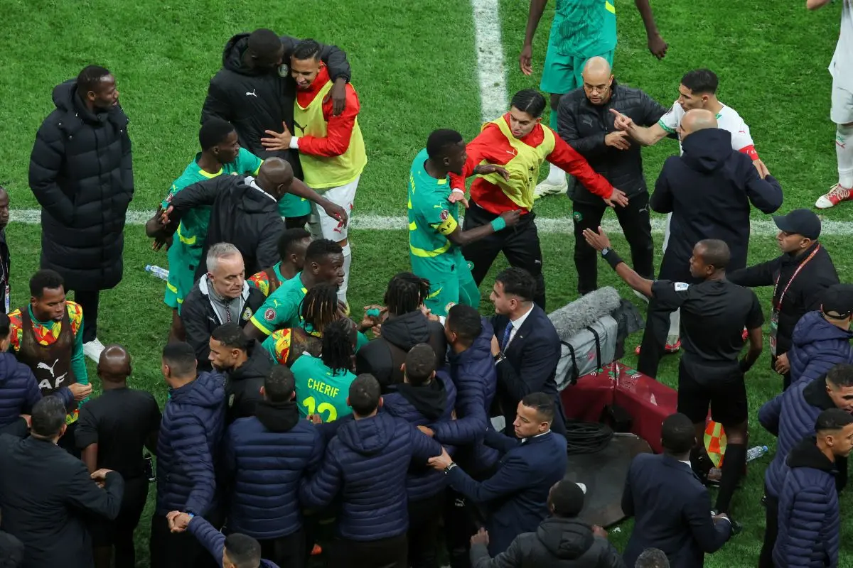 Players from both sides clash after a controversial penalty was awarded to Morocco late on during the Africa Cup of Nations final soccer match between Senegal and Morocco in Rabat, Morocco. | Photo: AP