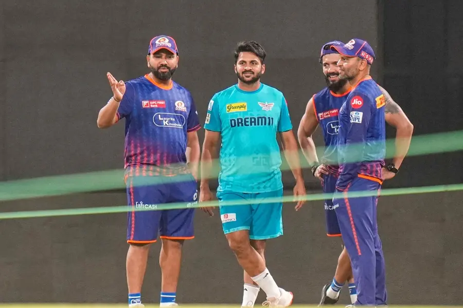 Mumbai Indians' Rohit Sharma with Lucknow Super Giants' Shardul Thakur during a practice session ahead of an Indian Premier League (IPL) 2025 cricket match between Mumbai Indians and Lucknow Super Giants