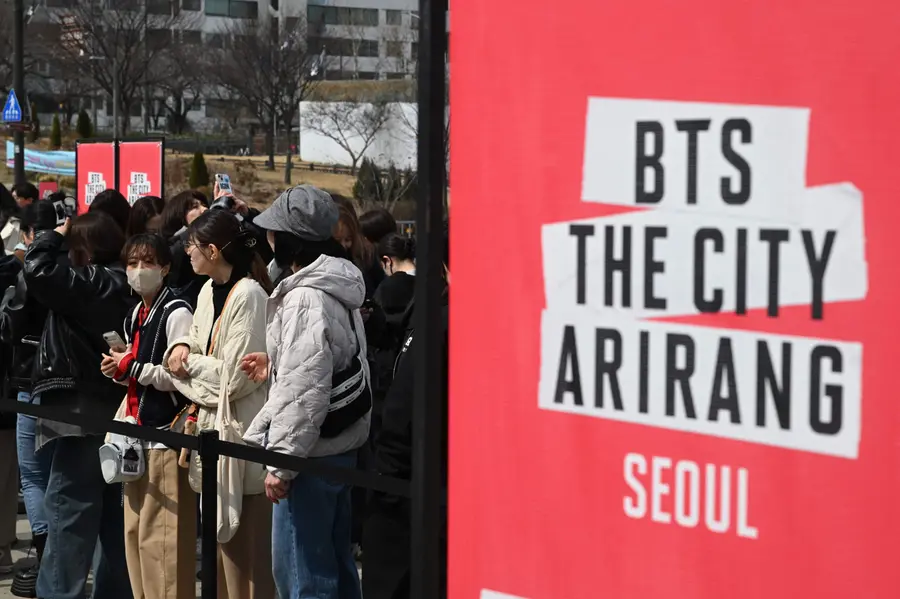 BTS fans wait in a line to enter a fan zone promoting the new album of K-pop boy band BTS at a riverside park in SeouL