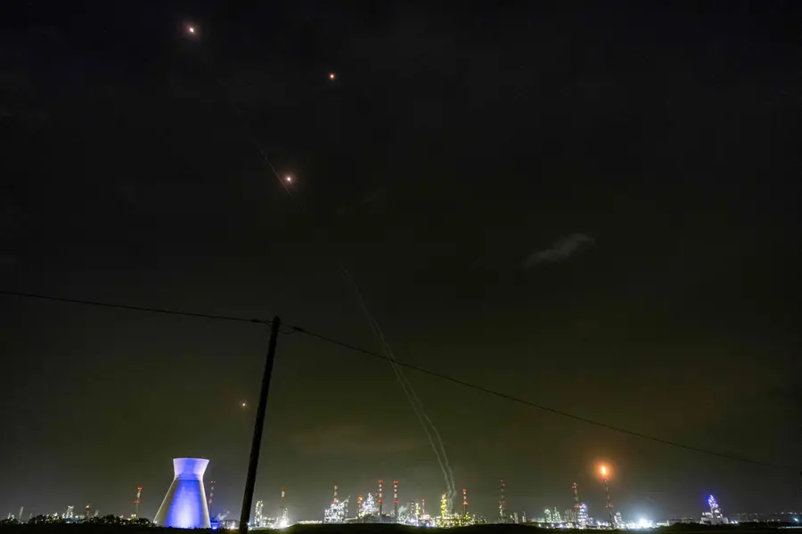 Trails and lights from missile defence interceptors are seen in the sky | AFP