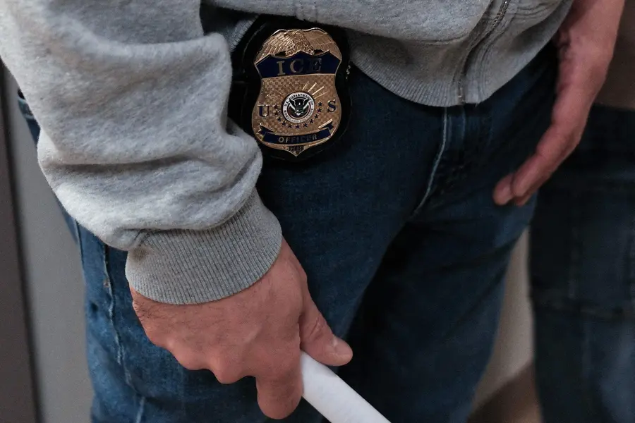ICE shield displayed on federal agent at New York Federal Plaza Immigration Court, Jacob K. Javits Federal Building