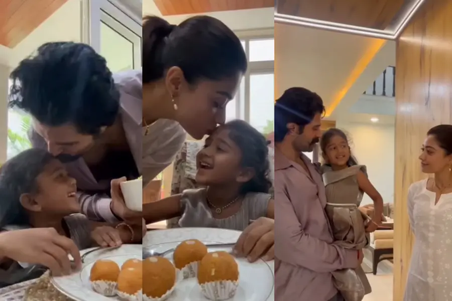 Vijay Deverakonda and Rashmika Mandanna smiling and serving lunch to their young fan at their residence