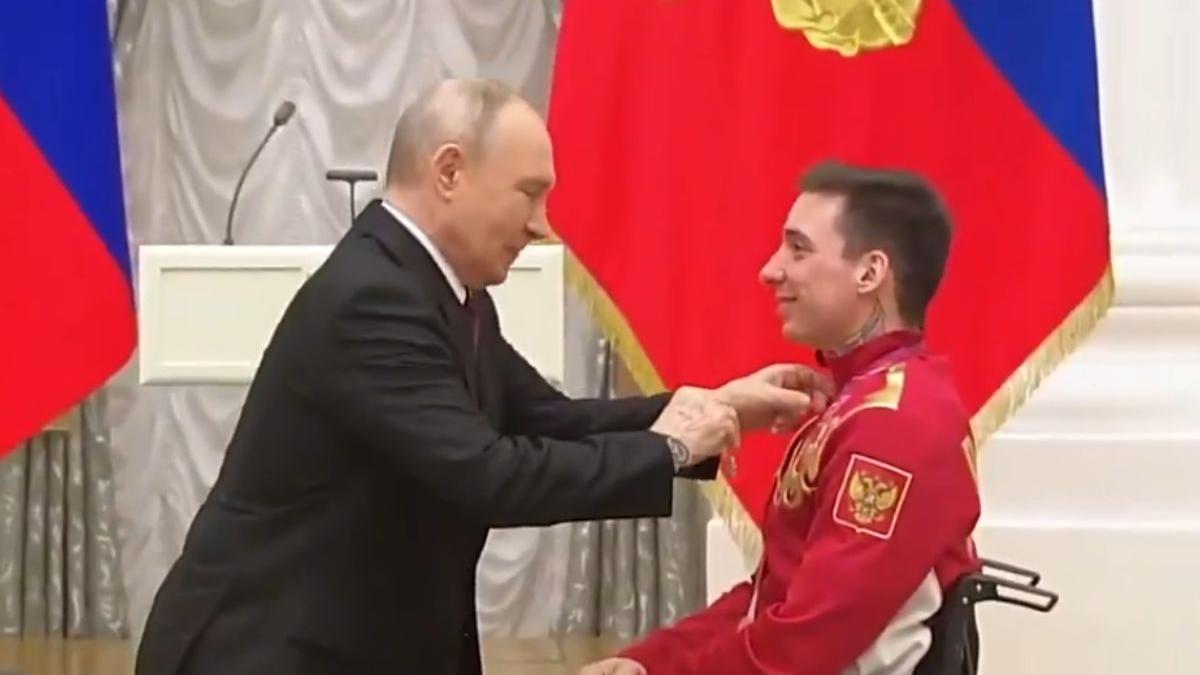 Putin kneels to present order of friendship to Russian Paralympic skier Ivan Golubkov | WATCH
