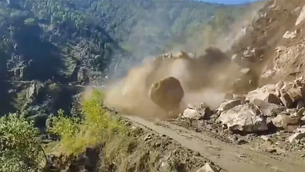 A boulder rolls down following a landslide triggered by heavy rains near Ropru village in Mandi district | PTI