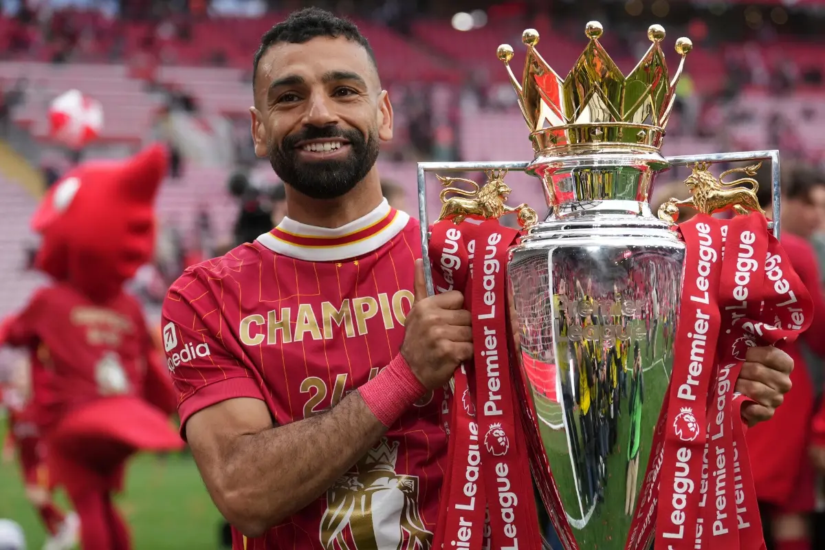 File: Liverpool's Mohamed Salah poses with the winner's trophy after the English Premier League soccer match between Liverpool and Crystal Palace at the Anfield stadium in Liverpool, England, May 25, 2025. | Photo: AP
