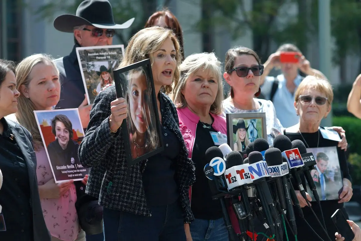 Julianna Arnold (C), whose daughter died after taking fentanyl-laced drugs provided by a man she met online, speaks to reporters outside of the Los Angeles Superior Court in Los Angeles, California. A Los Angeles jury found social media giants Meta and Google liable for designing addictive social media platforms that harmed a young woman's mental health. | Photo: AFP