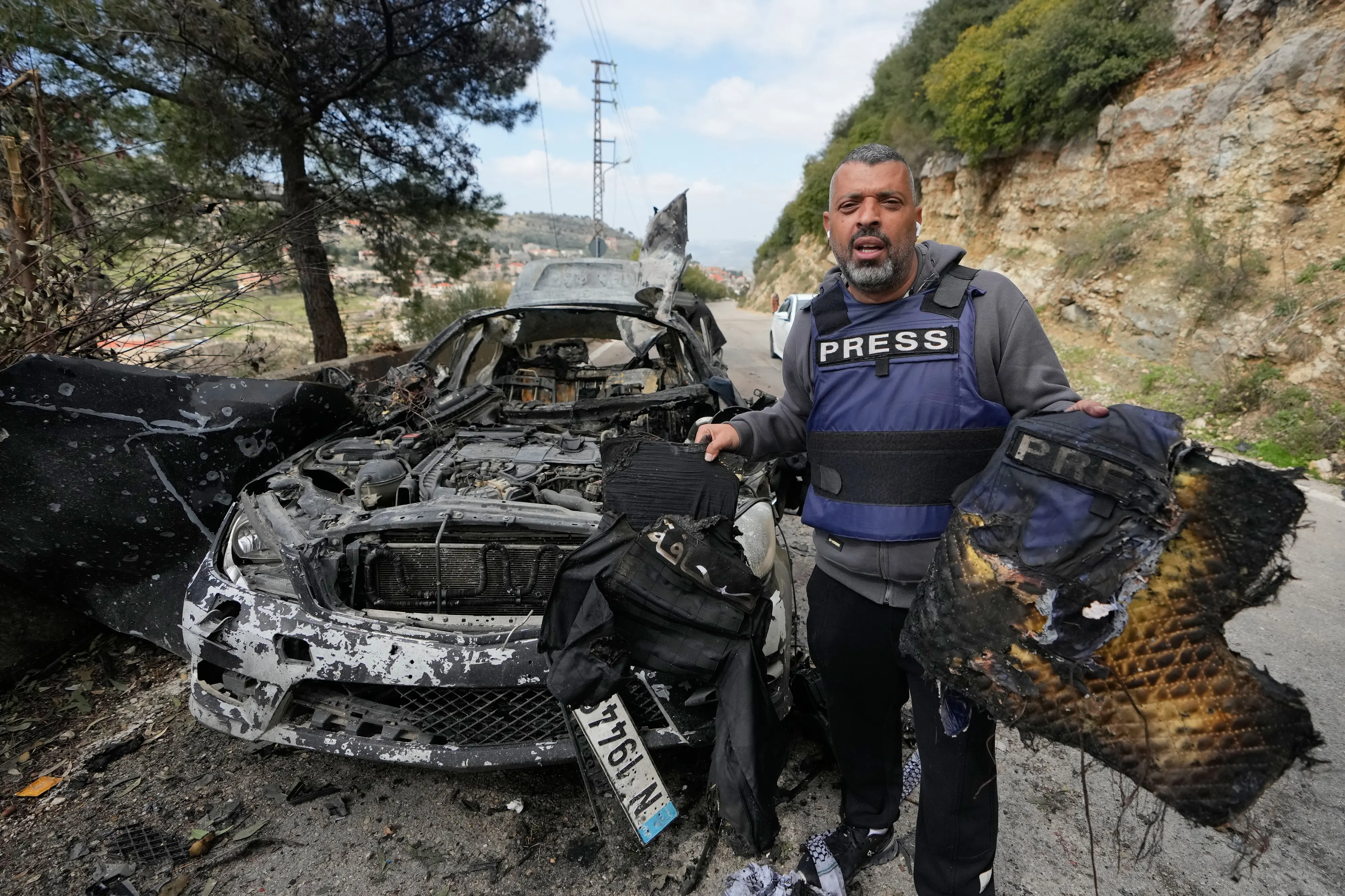 A journalist carries burned safety gear, following an Israeli airstrike on a car that killed Hezbollah's al-Manar TV correspondent Ali Shoeib, Beirut-based Al-Mayadeen TV reporter Fatima Ftouni and her brother, video journalist Mohammed Ftouni | PTI