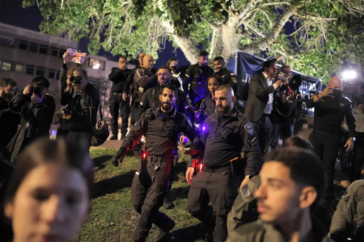 Israeli security forces attempt to disperse protesters from the weekly anti-war demonstration at HaBima Square in Tel Aviv on March 28, 2026 (Photo: AFP)