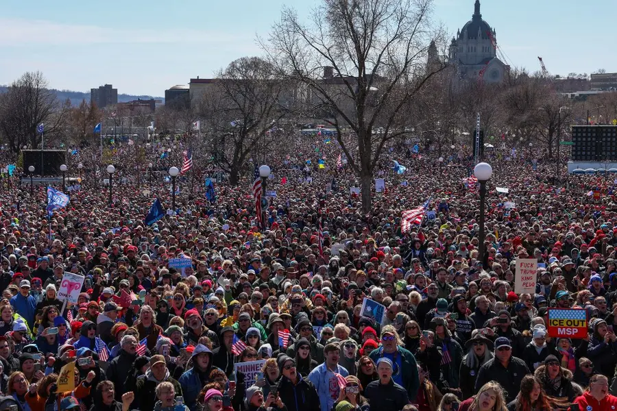 Tens of thousands of protesters chant outside the Minnesota State Capitol during the \"No Kings\" march in St. Paul, Minn