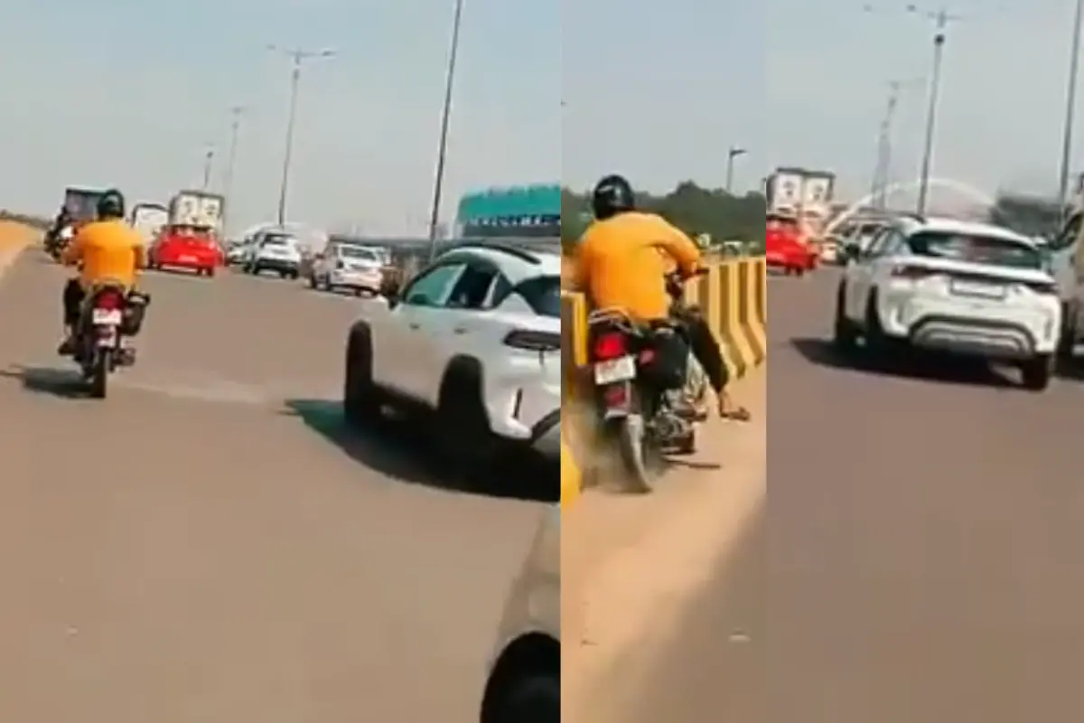 Viral video showing the boy hurling balloons from inside the car at the bike rider