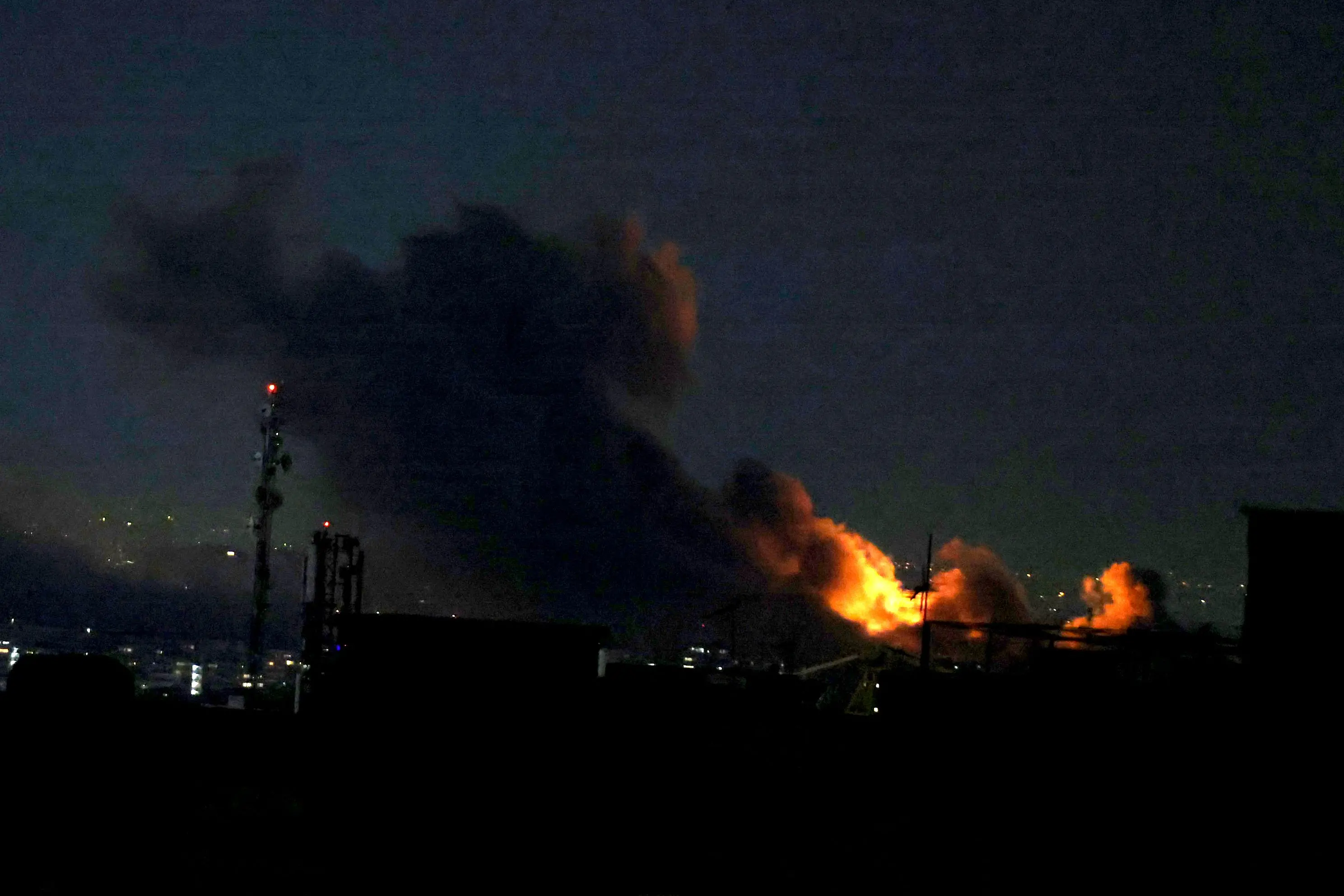 A plume of smoke rises from the site of a strike in Tehran | AFP