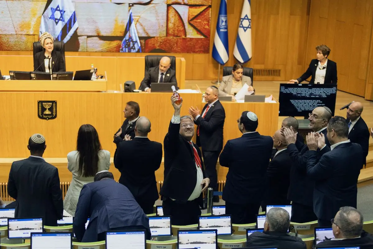 Israel's Minister of National Security, Itamar Ben-Gvir, center, and lawmakers celebrate after Israel's parliament passed a law approving the death penalty for Palestinians convicted of murdering Israelis, at the Knesset in Jerusalem Monday, March 30, 2026 (Photo: AP)