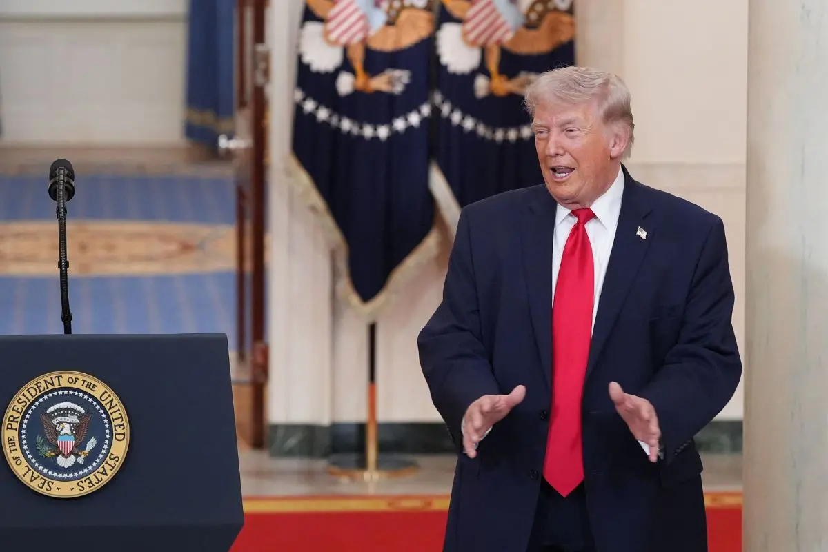 US President Donald Trump gestures after speaking at a televised address on the conflict in the Middle East from the Cross Hall of the White House in Washington, DC on April 1, 2026. (Photo by Alex Brandon / POOL / AFP)
