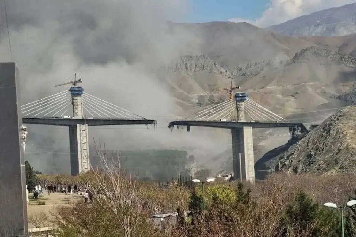Smoke rises as sections of Tehran's tallest B1 Bridge in Karaj collapse following reported US-Israel airstrikes, amid escalating tensions with Iran. (Photo: X)