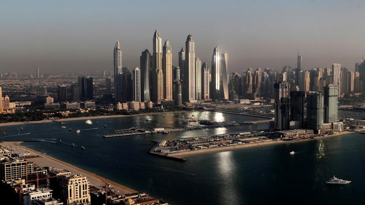 Dubai authorities confirm debris from an aerial interception hit a building in Dubai Marina. No injuries or fire reported, officials say.