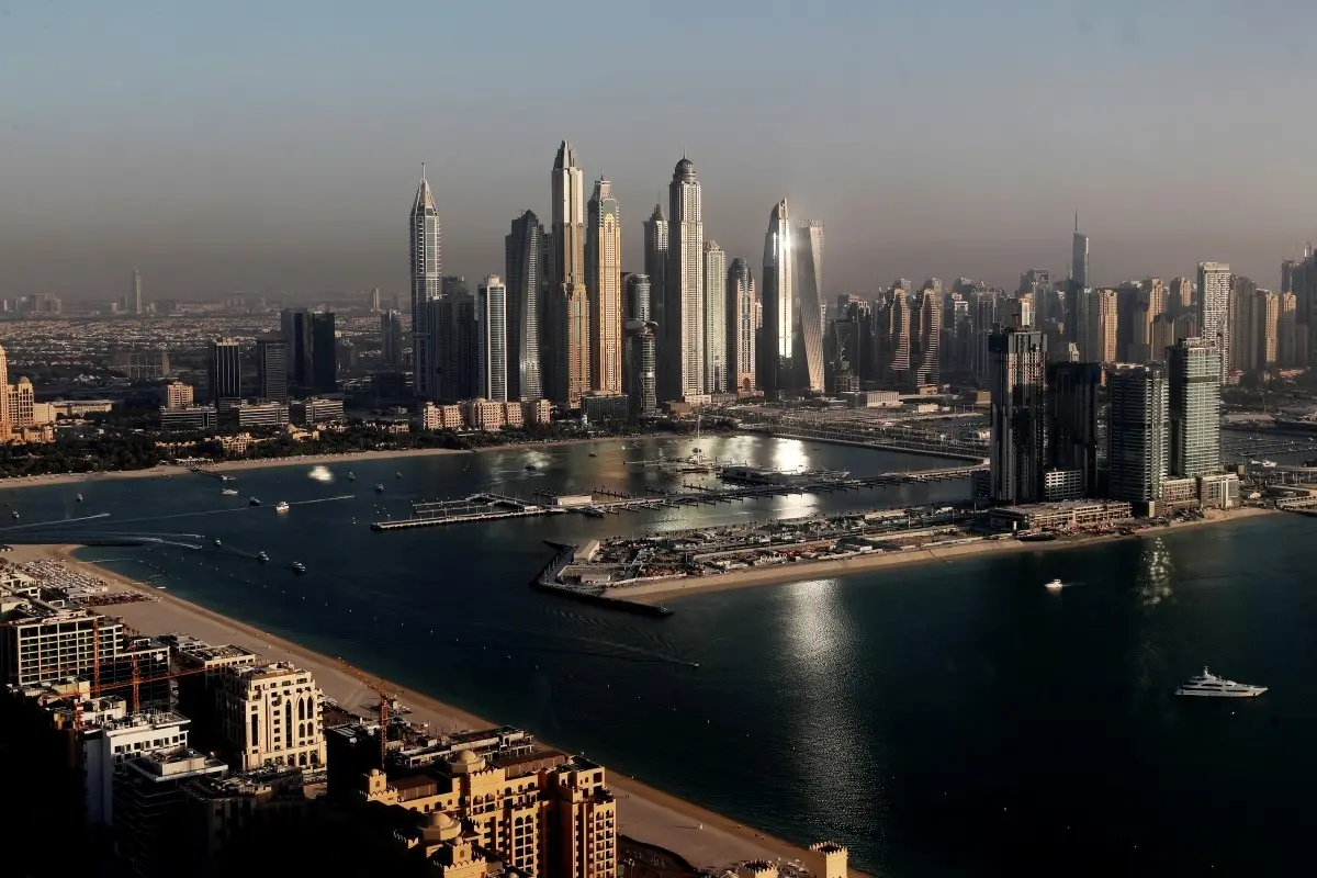 FILE - Luxury towers that dominate the skyline in the Dubai Marina district, center, and the new Dubai Harbor development, right, are seen from the observation deck of 'The View at The Palm Jumeirah' in Dubai, United Arab Emirates