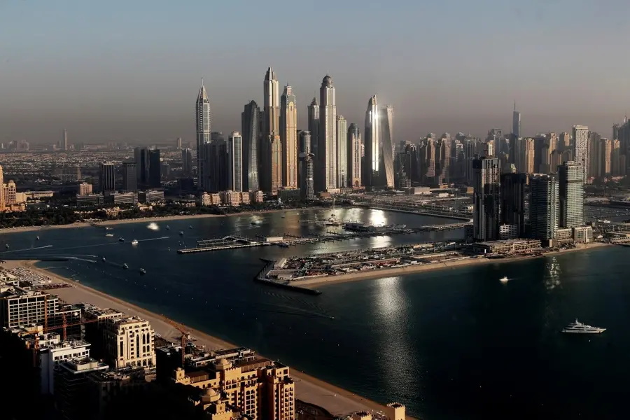 FILE - Luxury towers that dominate the skyline in the Dubai Marina district, center, and the new Dubai Harbor development, right, are seen from the observation deck of 'The View at The Palm Jumeirah' in Dubai, United Arab Emirates