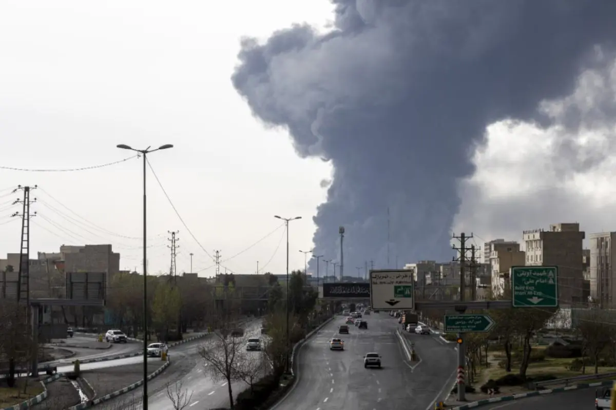 Thick plumes of black smoke rise into the sky after a massive fire broke out at Bahrain's Bapco oil facility following a suspected strike.