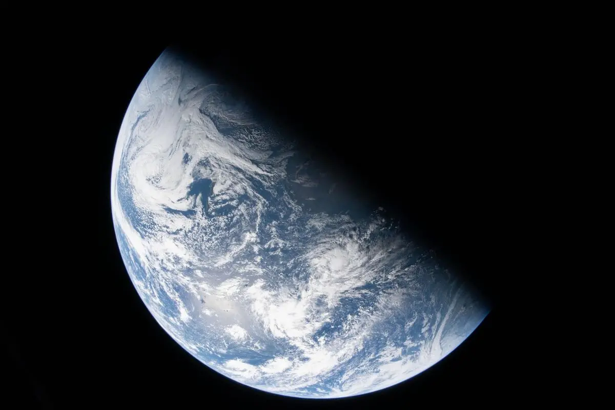 This image from video provided by NASA shows a view of earth taken by NASA astronaut and Artemis II Commander Reid Wiseman from one of the Orion spacecraft's four windows after completing the translunar injection burn, Thursday, April 2, 2026 (NASA via AP)