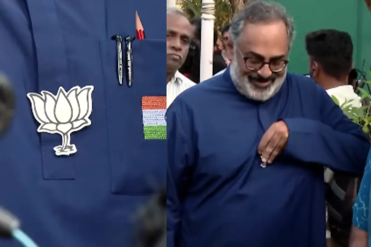 Rajeev Chandrasekar removing the BJP logo from his shirt outside the polling booth