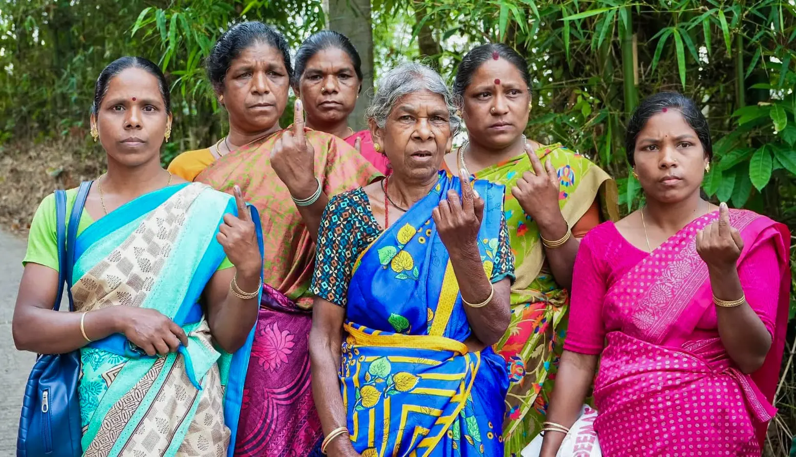 Elderly women show their ink-marked fingers after they cast their vote for the Kerala assembly election at Idamalakkudi | ANI