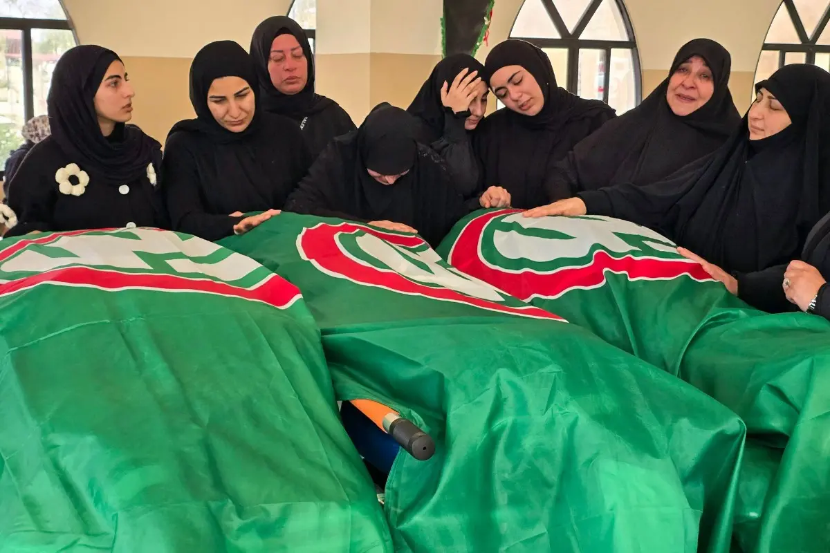 Mourners gather around the bodies of people killed earlier this week by Israeli airstrikes | Photo: AFP