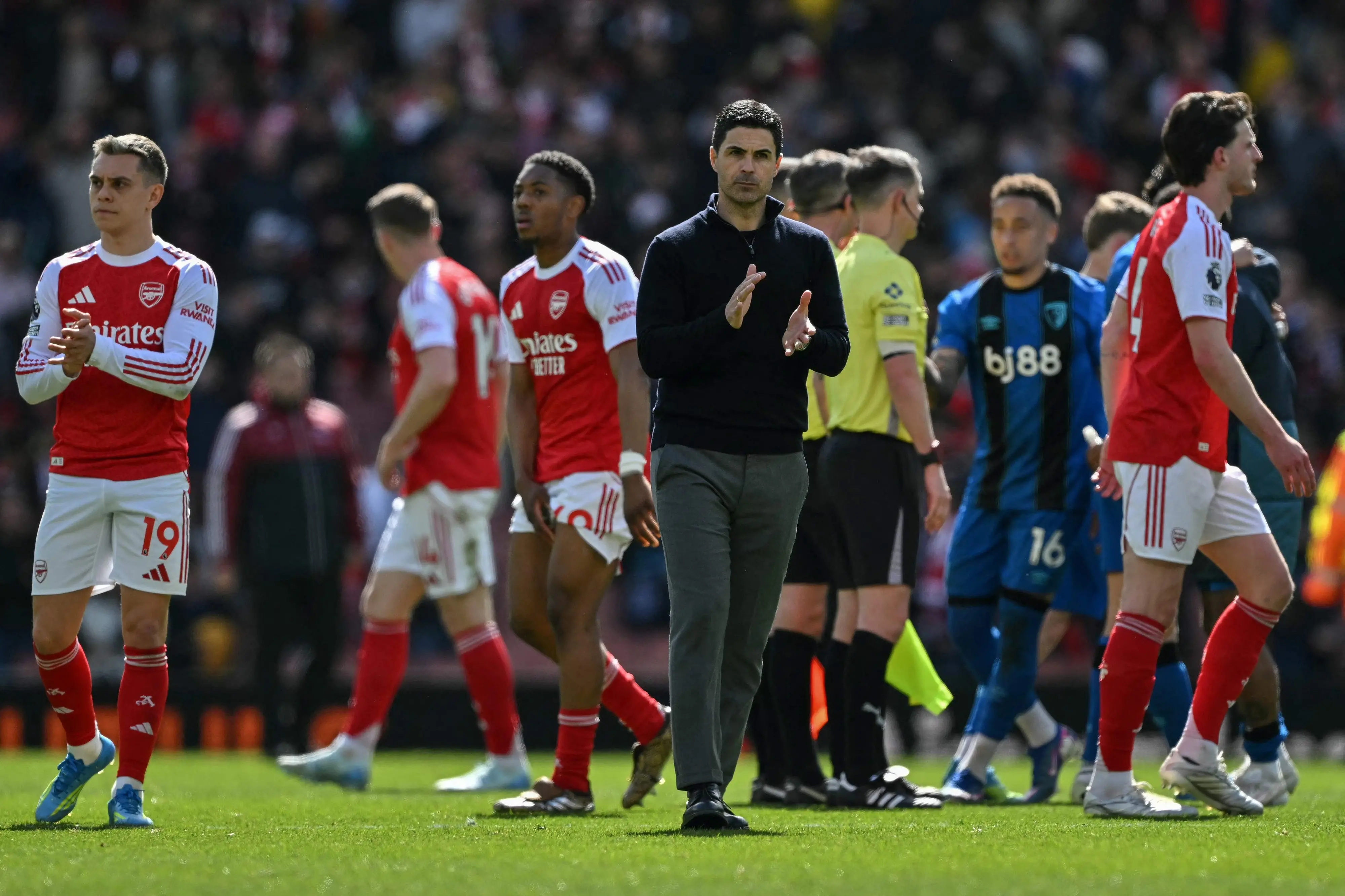 Arsenal's Spanish manager Mikel Arteta (C) claps at the end of the English Premier League football match between Arsenal and Bournemouth | AFP