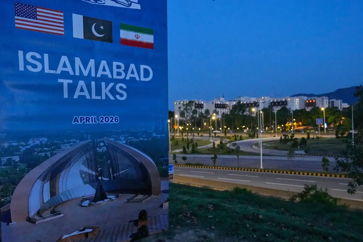 A billboard of the U.S. Iran talks is seen near Serena Hotel, the venue for the U.S. Iran officials meeting, in Islamabad | Photo: AP
