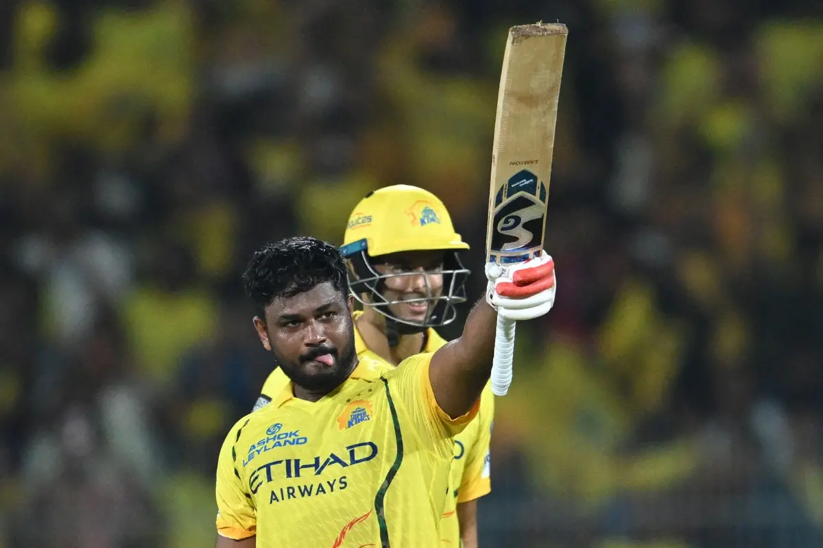 Chennai Super Kings' Indian cricket player Sanju Samson (L) celebrates after scoring a century (100 runs) during the 2026 Indian Premier League (IPL) T20 match between Chennai Super Kings and Delhi Capitals | Photo: AFP