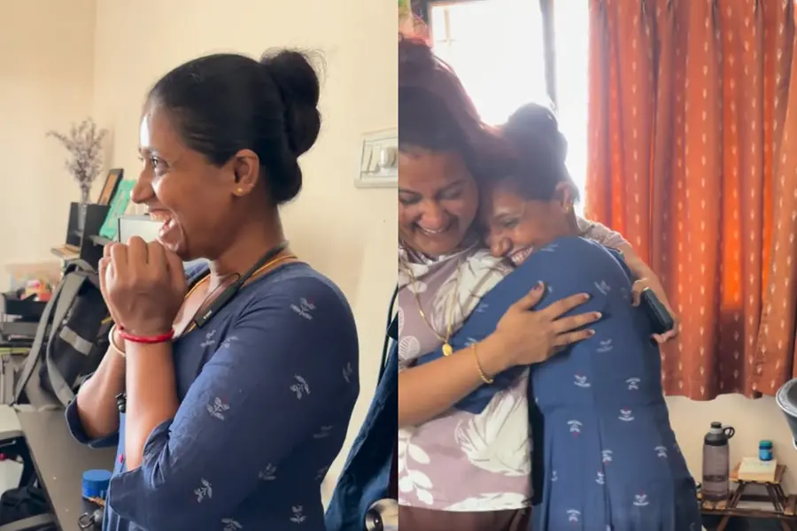 A joyful domestic worker reacting with a wide smile and surprise as she sees a new air cooler gifted by her employers.