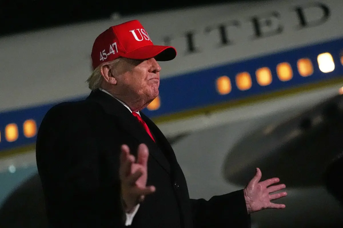 US President Donald Trump speaks with reporters at Joint Base Andrews | Photo: AP