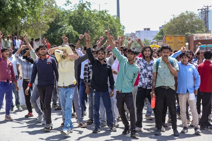 Factory workers during a protest demanding a hike in wages, in Noida