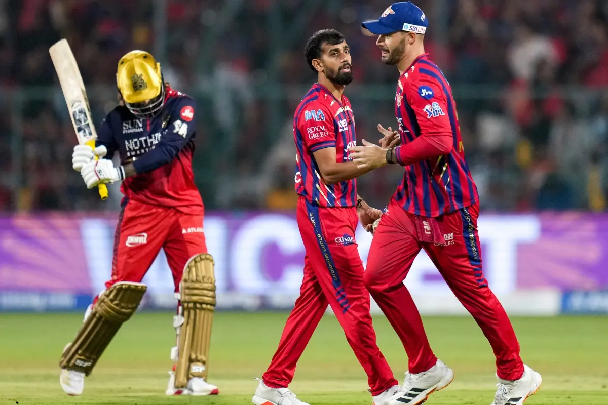 Lucknow Super Giants' Prince Yadav, second right, with Aiden Markram, right, celebrates after taking the wicket of Royal Challengers Bengaluru's captain Rajat Patidar during the Indian Premier League (IPL) 2026 T20 cricket match between Royal Challengers Bengaluru and Lucknow Super Giants, at M Chinnaswamy Stadium in Bengaluru, Karnataka.| Photo: PTI