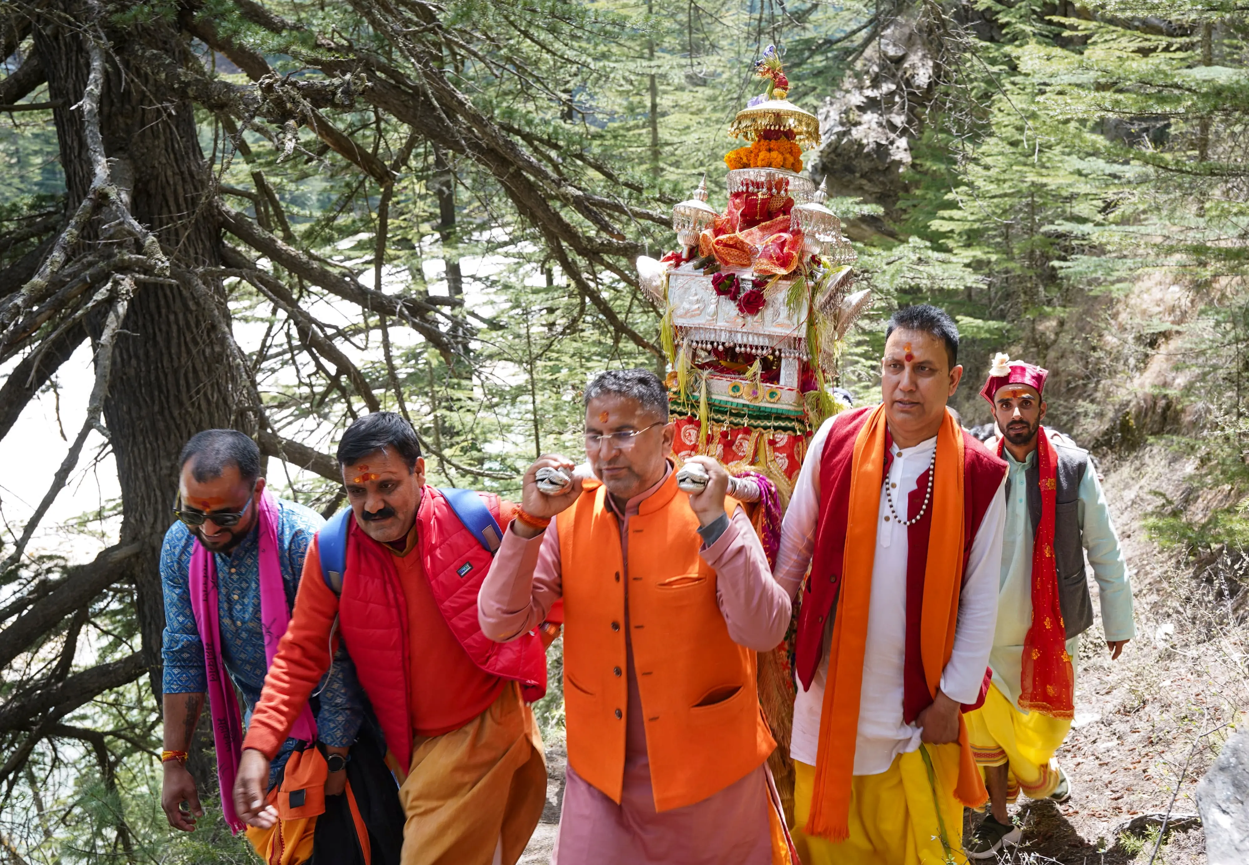 Devotees carry the palanquin of Goddess Ganga during its procession from Mukhwa to Gangotri Dham | Photo: PTI