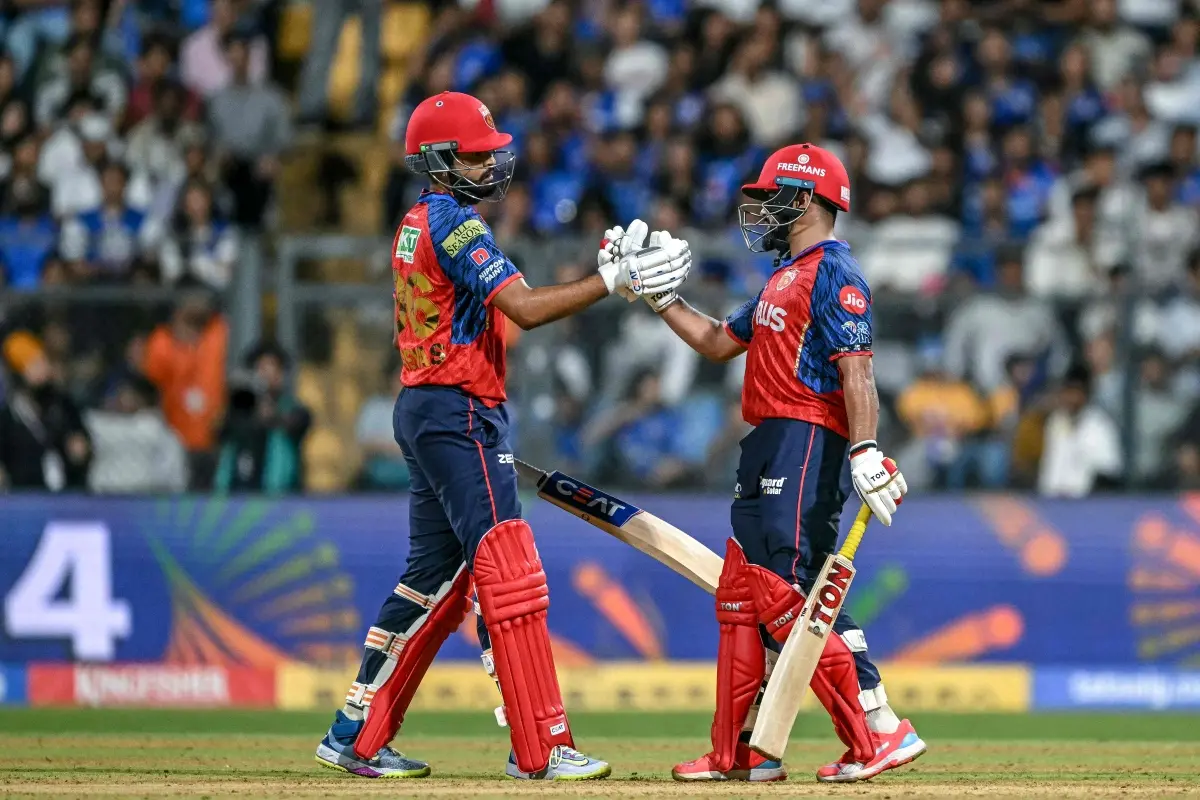 Punjab Kings' Indian cricket player Prabhsimran Singh (R) celebrates with his captain Indian cricket player Shreyas Iyer after scoring a half-century (50 runs) during the 2026 Indian Premier League (IPL) T20 match between Mumbai Indians and Punjab Kings at the Wankhede Stadium in Mumbai. | Photo: AFP