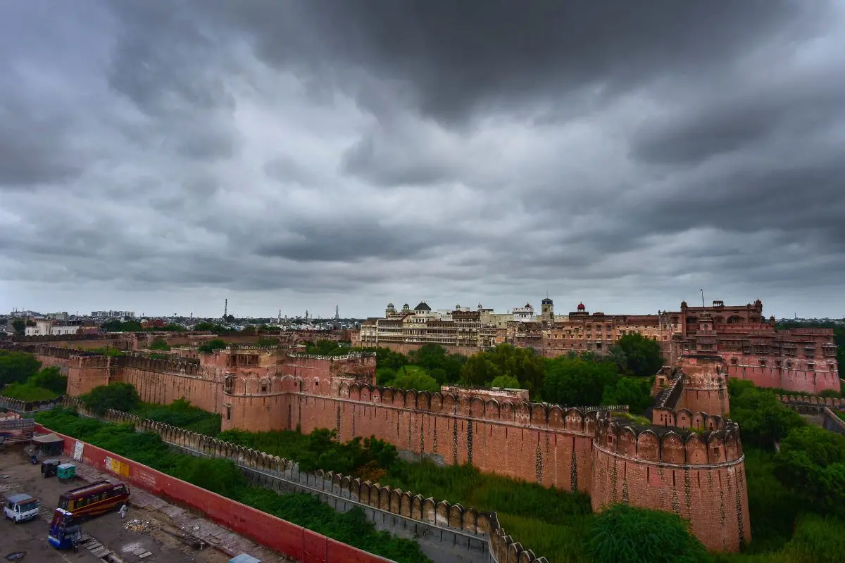 A sweeping view of Bikaner's historic Junagarh Fort and cityscape under dramatic monsoon clouds, as the desert city marks its 539th Foundation Day.