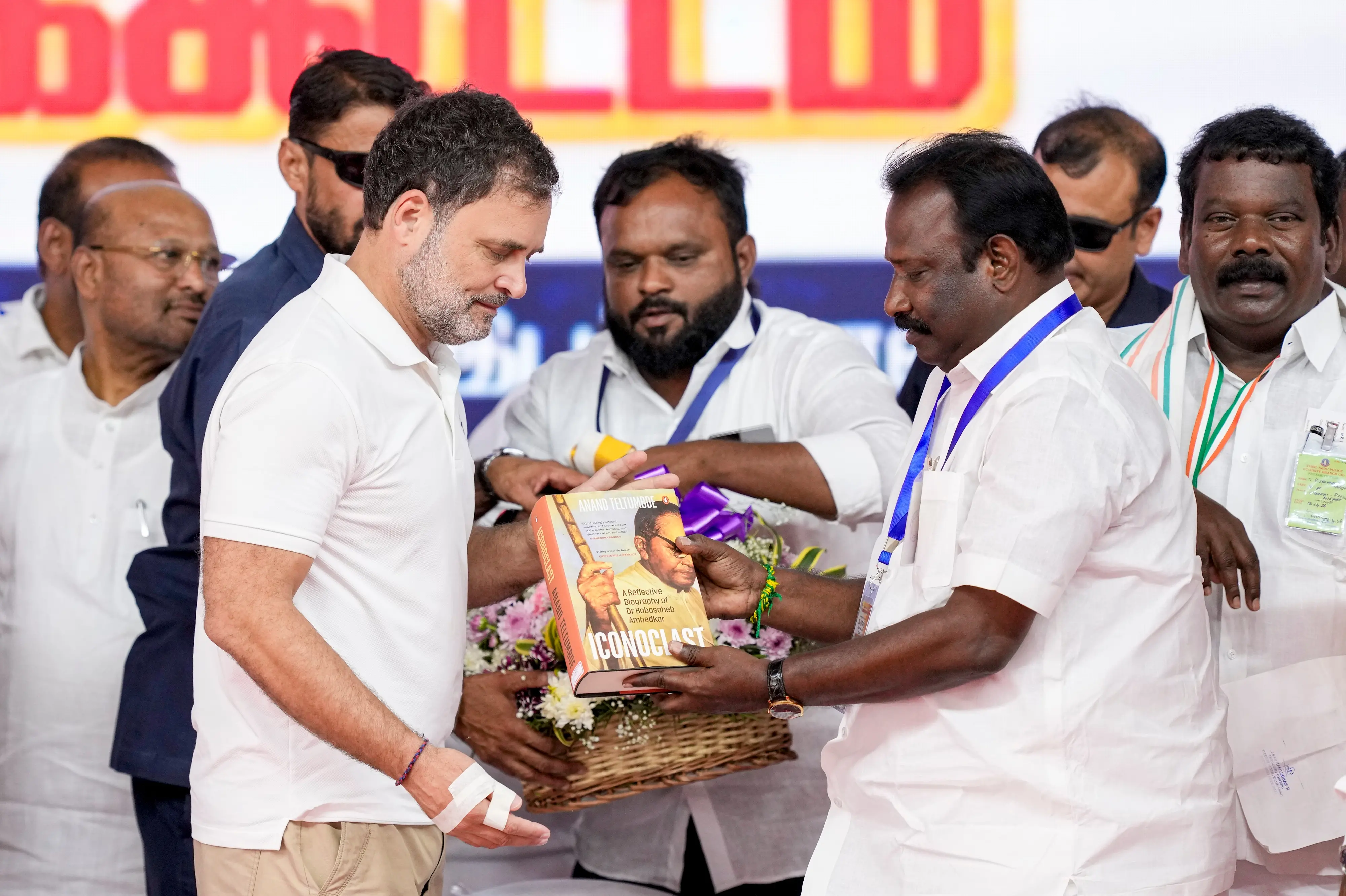 Rahul Gandhi is being felicitated during a public meeting, ahead of the Tamil Nadu Assembly elections. Tamil Nadu Congress Committee President K Selvaperunthagai is also seen. | PTI