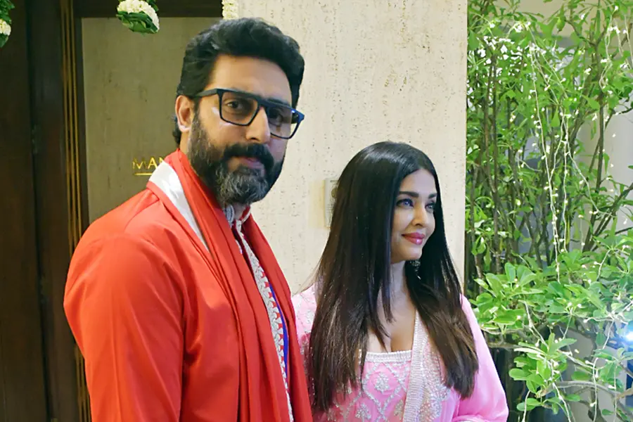 A candid and smiling photo of Aishwarya Rai and Abhishek Bachchan during a public appearance, reflecting their long-standing companionship on their 19th wedding anniversary