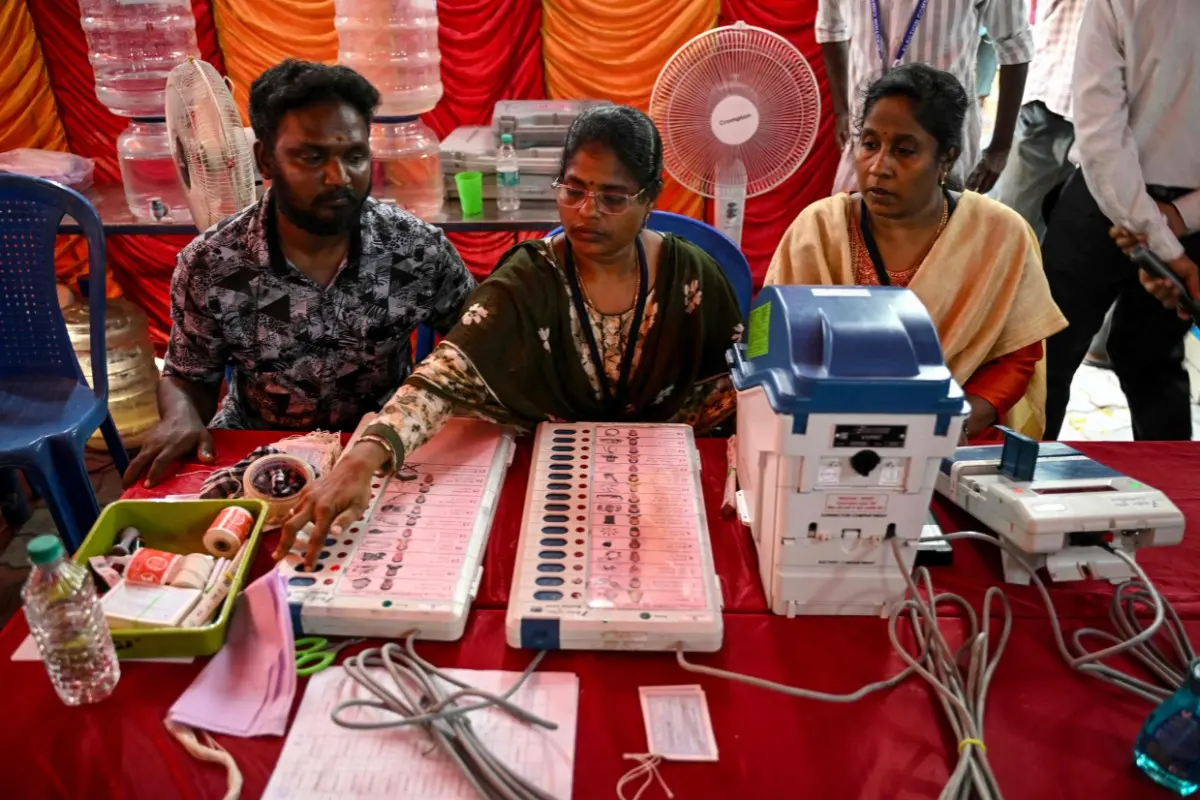 Poll officials prepare and install candidate names and symbols in Electronic Voting Machines (EVMs) in Chennai | Photo: AFP