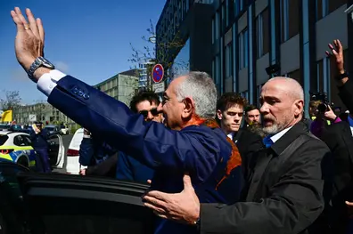Iran’s exiled crown prince Reza Pahlavi splattered with red liquid in Berlin