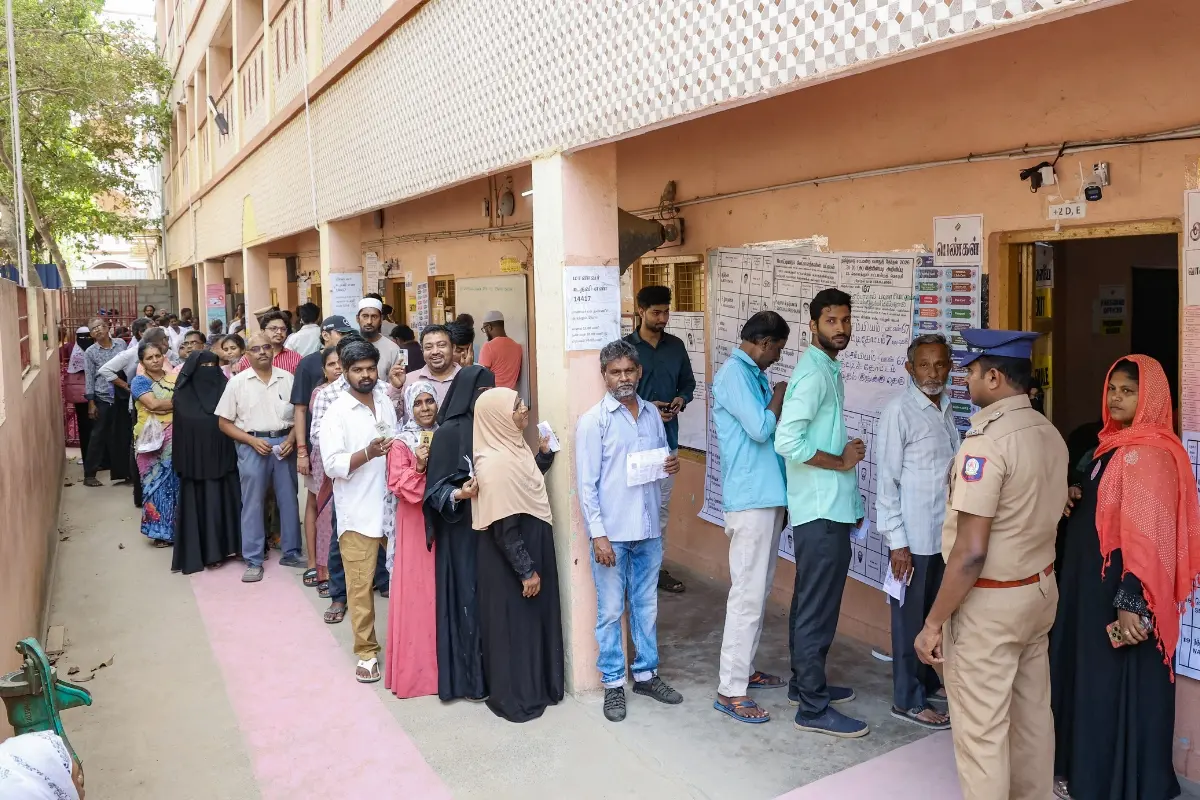 Voters queue up as they wait to cast their votes during the first phase of the Tamil Nadu Assembly election, in Chennai.| Photo: ANI