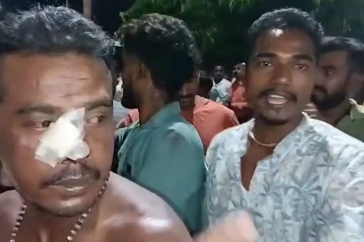 An injured man with a bandaged nose speaks amid a crowd in Kalyani after alleged pre-poll violence left BJP workers hurt and tensions high. (Screengrab: YouTube)